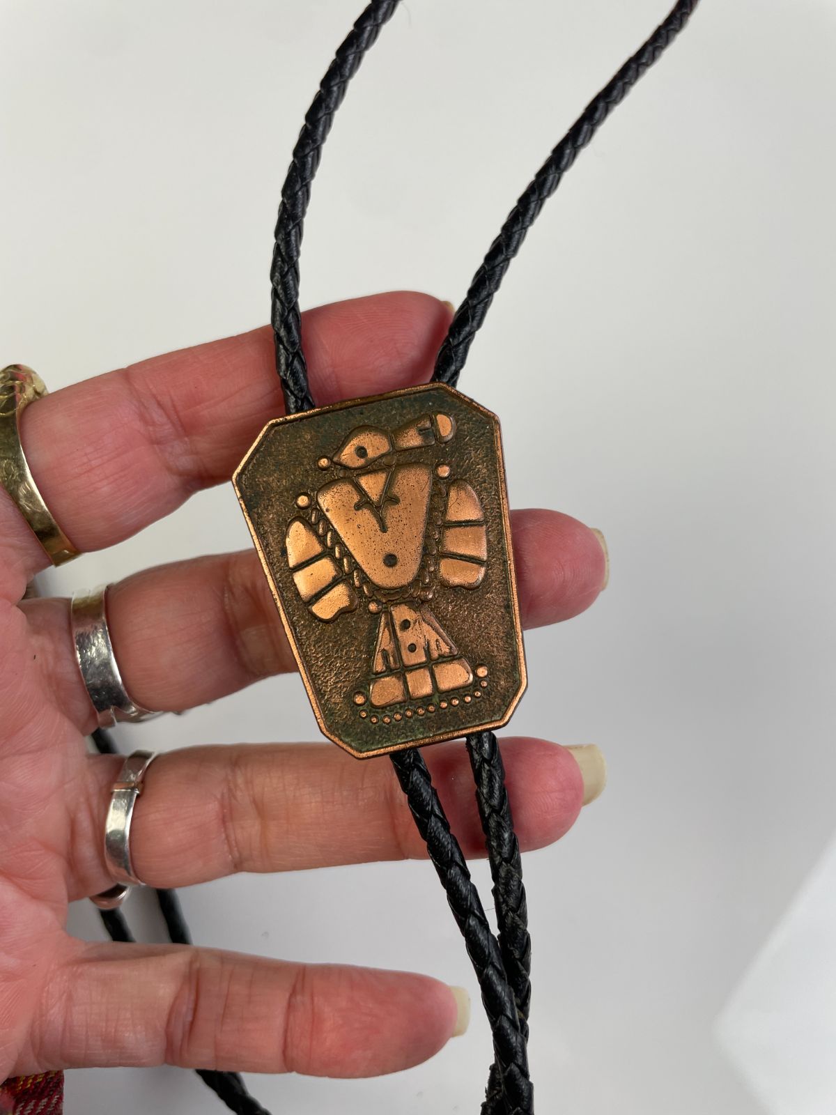 STAMPED COPPER THUNDERBIRD BOLO TIE in BLACK, BROWN