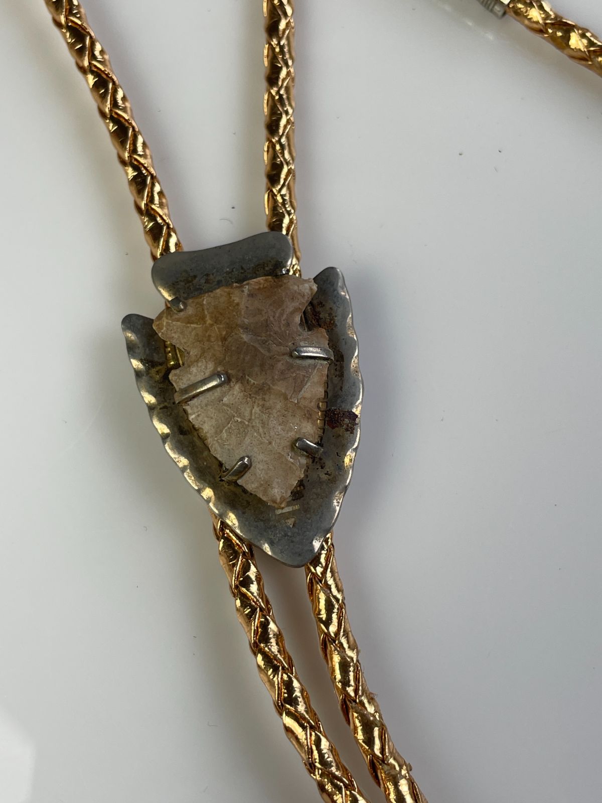 product details: MOUNTED ARROWHEAD BOLO TIE, METALLIC BRAIDED CORD photo