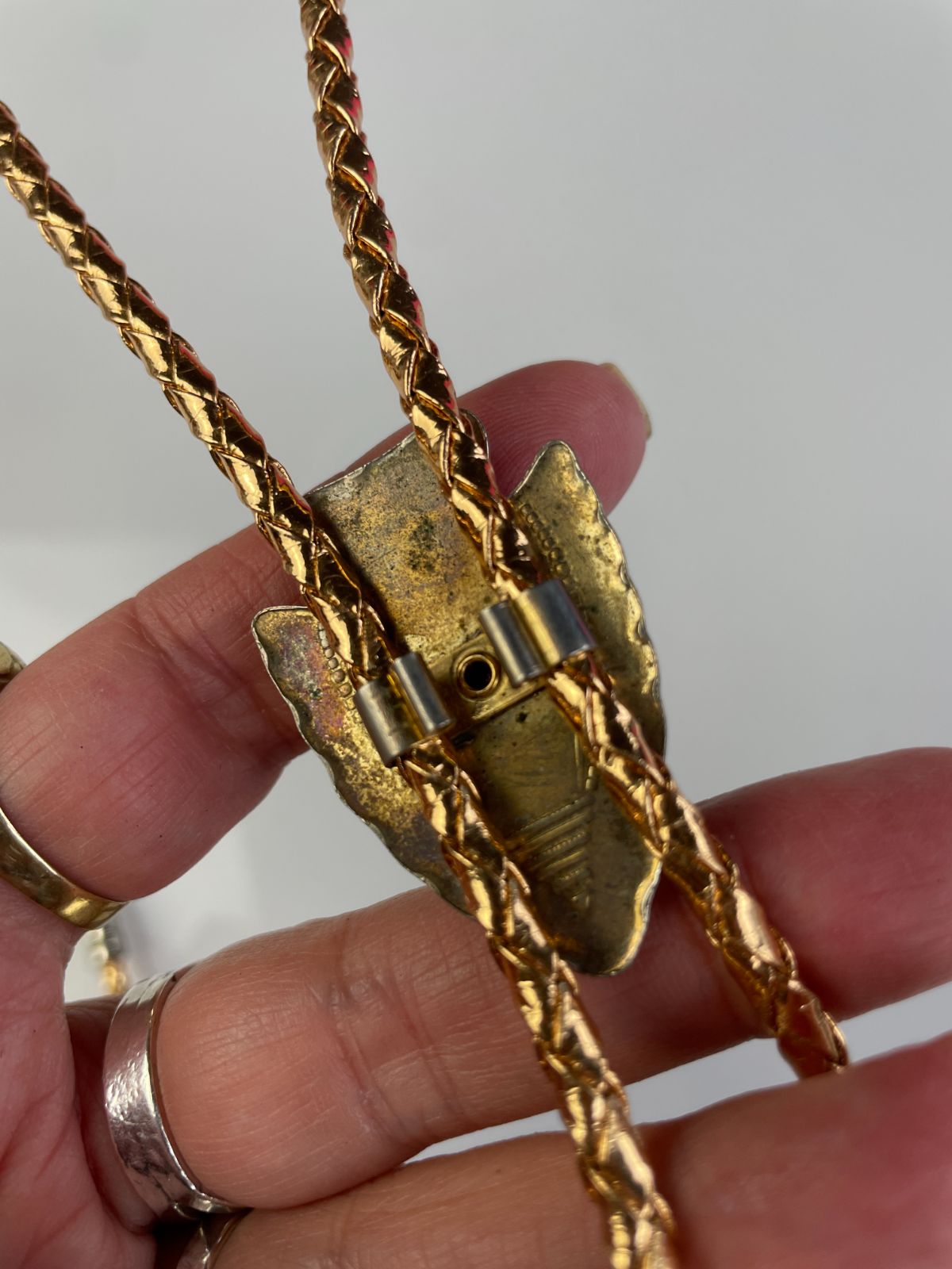 product details: MOUNTED ARROWHEAD BOLO TIE, METALLIC BRAIDED CORD photo