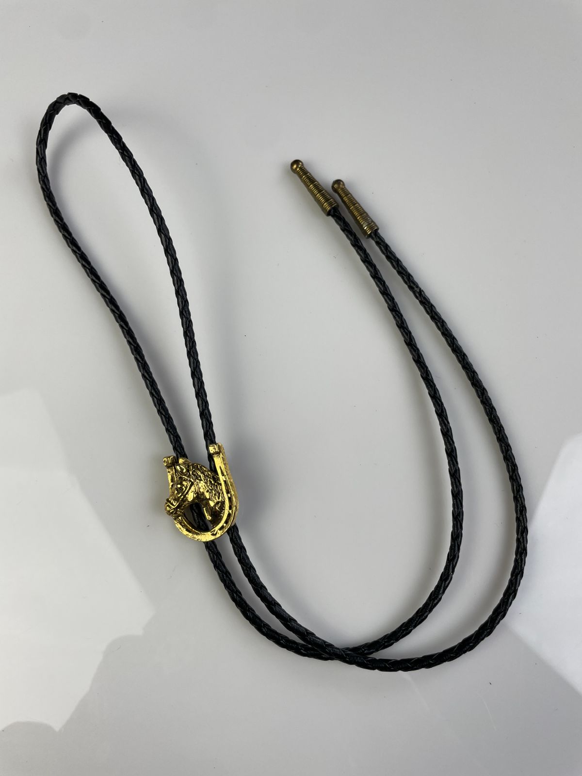 GOLD PLATED HORSE PROFILE & HORSESHOE BOLO TIE, BRAIDED LEATHER CORD in BLACK, GOLD