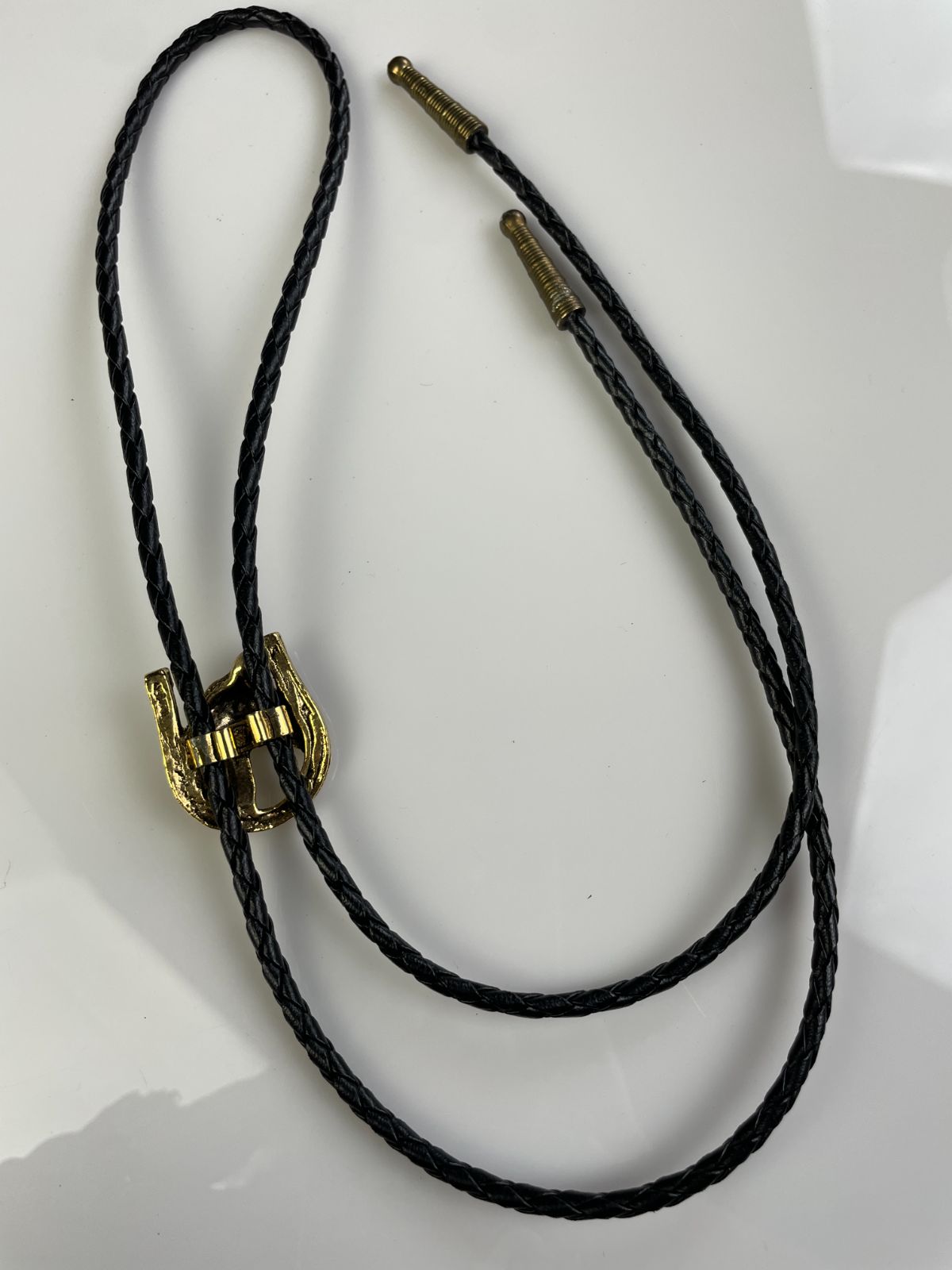 GOLD PLATED HORSE PROFILE & HORSESHOE BOLO TIE, BRAIDED LEATHER CORD in BLACK, GOLD
