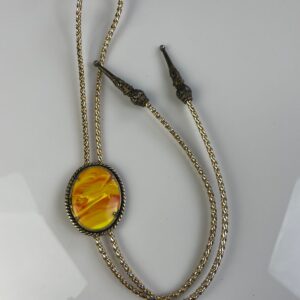 Photo detail:OVAL POLISHED MARBLED GLASS STONE BOLO TIE, TWISTED ROPE SETTING