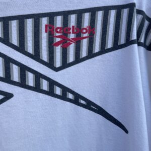 REEBOK *AS-IS* 1990S OVERSIZED STRIPED REEBOK LOGO GRAPHIC T-SHIRT in WHITE, BLACK