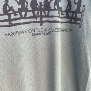 ALORE 1990 ALL OVER COWBOYS ON FENCE SILHOUETTE GRAPHIC T-SHIRT HARGRAVE CATTLE RANCH MARION MT in GREEN, BLACK