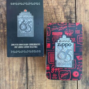 ZIPPO AS-IS DEADSTOCK 1997 65TH ANNIVERSARY ZIPPO LIGHTER W/ METAL DISPLAY TIN