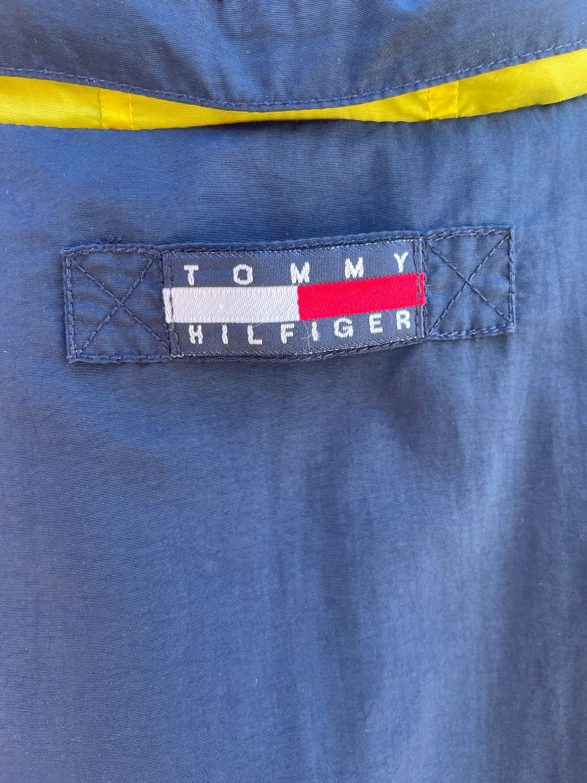 TOMMY HILFIGER TOMMY HILFIGER COLORBLOCK SAILING JACKET W/ HIDEAWAY HOOD in RED, BLUE, YELLOW