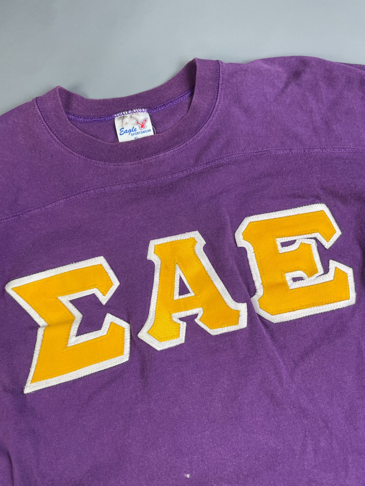 EAGLE SPORTSWEAR *AS-IS* COOL! 1970S-80S FRATERNAL LETTERING 100% COTTON RINGER TSHIRT in PURPLE, YELLOW