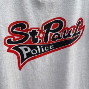 REACH 1980/90S ST. PAUL POLICE GRAPHIC HENLEY STYLE SINGLE STITCH TSHIRT in WHITE, RED, BLACK