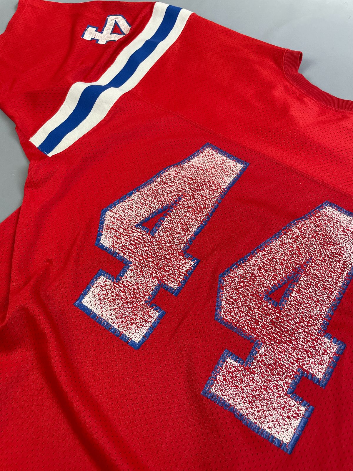 MACGREGOR PERFECTLY DISTRESSED AUTHENTIC 80'S JOHN STEPHENS NEW ENGLAND PATRIOTS SAND-KNIT #44 FOOTBALL JERSEY in RED, BLUE, WHITE