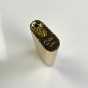 COLIBRI 1950S MADE IN JAPAN SLENDER LINED METAL REFILLABLE ELECTRONIC LIGHTER, MONOGRAMMED DETAIL in GOLD