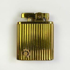 SO COOL! 1960S RIBBED BRASS REFILLABLE LIGHTER MUSICAL LIGHTER WINDUP MUSIC MECHANISM in GOLD