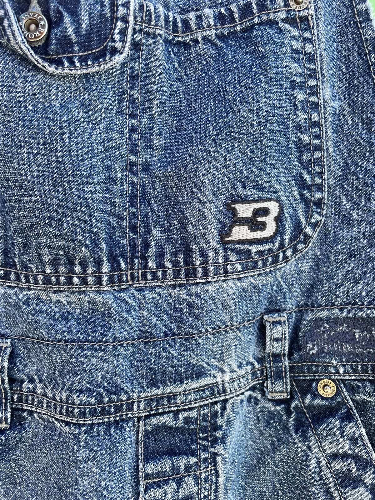 BRODY OVERALLS Y2K PERFECTLY DISTRESSED MEDIUM WASH FLARED DENIM OVERALLS in BLUE