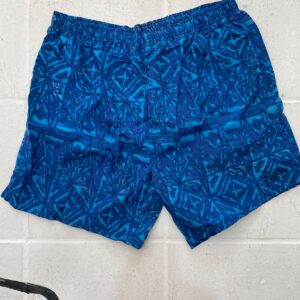 BUGLE BOY SPORT 1990S TONAL TIKI PRINT NYLON ELASTIC WAIST SWIM SHORTS W/ MESH INNER LINING in BLUE