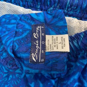 BUGLE BOY SPORT 1990S TONAL TIKI PRINT NYLON ELASTIC WAIST SWIM SHORTS W/ MESH INNER LINING in BLUE