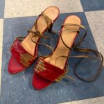 RED LEATHER HEELS WITH GOLD STRAPS AND LACE-UP DETAIL