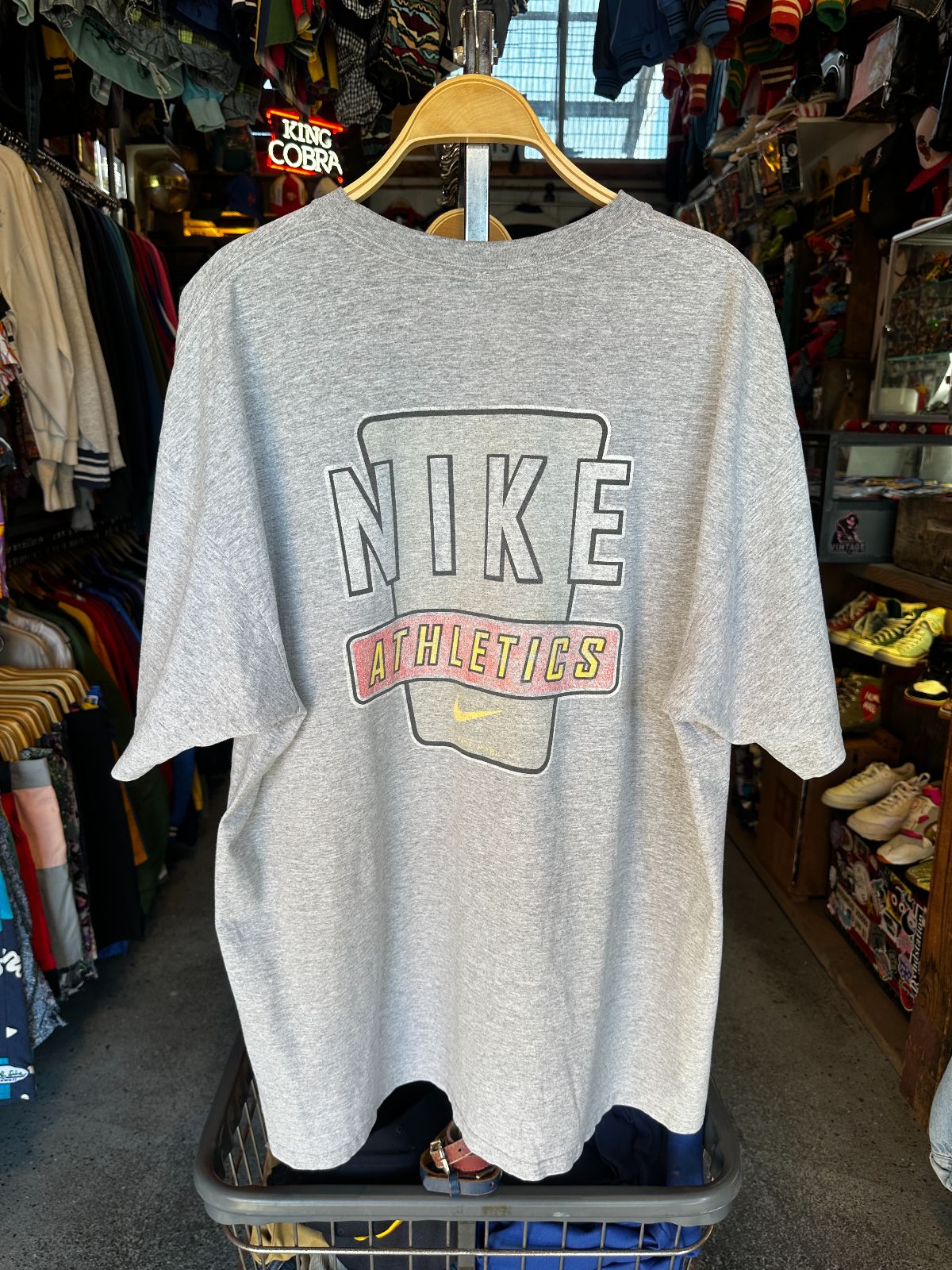 NIKE 1990S | EARLY Y2K OVERSIZED NIKE MADE IN MEXICO T-SHIRT WITH SMALL SWOOSH LOGO, LARGE BACK GRAPHIC in GRAY