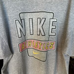 NIKE 1990S | EARLY Y2K OVERSIZED NIKE MADE IN MEXICO T-SHIRT WITH SMALL SWOOSH LOGO, LARGE BACK GRAPHIC in GRAY