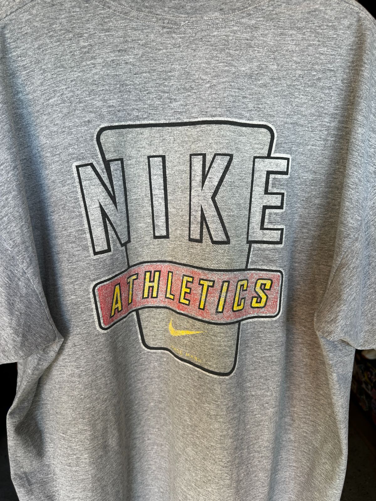 NIKE 1990S | EARLY Y2K OVERSIZED NIKE MADE IN MEXICO T-SHIRT WITH SMALL SWOOSH LOGO, LARGE BACK GRAPHIC in GRAY
