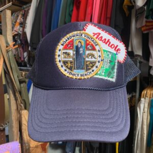 BOARDWALK X BEACH BUMS NEVER DIE BOARDWALK VINTAGE X BEACH BUMS NEVER DIE STACK OF PATCHES RE-WORKED TRUCKER HAT in BLUE, RED, WHITE, YELLOW, BLACK, GREEN