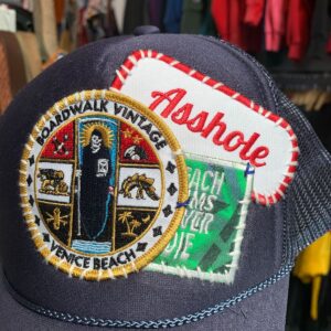 BOARDWALK X BEACH BUMS NEVER DIE BOARDWALK VINTAGE X BEACH BUMS NEVER DIE STACK OF PATCHES RE-WORKED TRUCKER HAT in BLUE, RED, WHITE, YELLOW, BLACK, GREEN