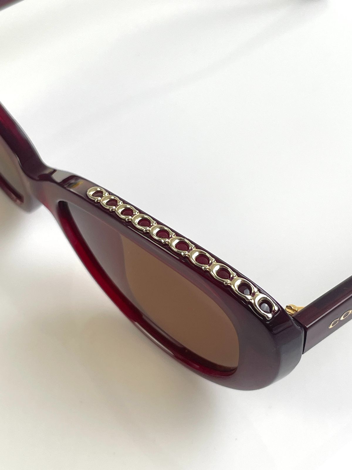 COACH CUSTOM TINT, ROUNDED CAT EYE SUNGLASSES, MONOGRAM C-CHAIN EMBELLISHED TOP BROW - AUBERGINE in MAROON,