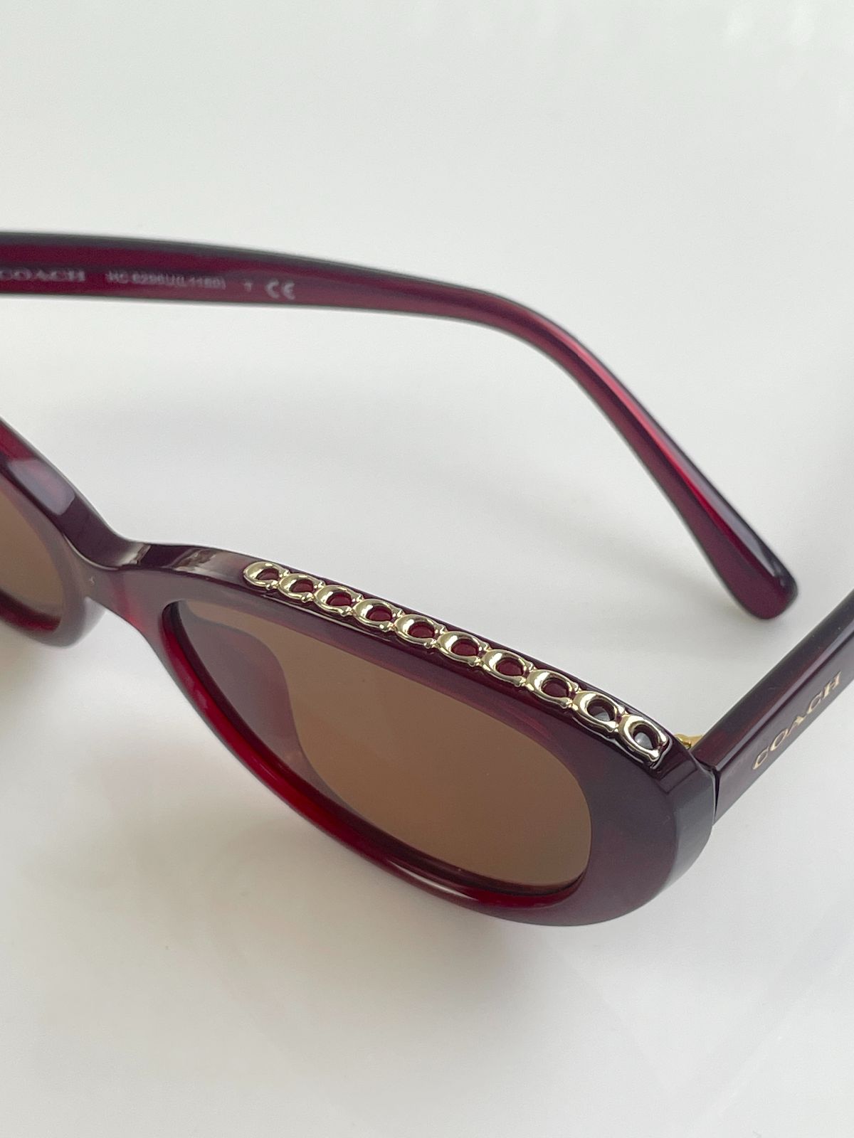 COACH CUSTOM TINT, ROUNDED CAT EYE SUNGLASSES, MONOGRAM C-CHAIN EMBELLISHED TOP BROW - AUBERGINE in MAROON,