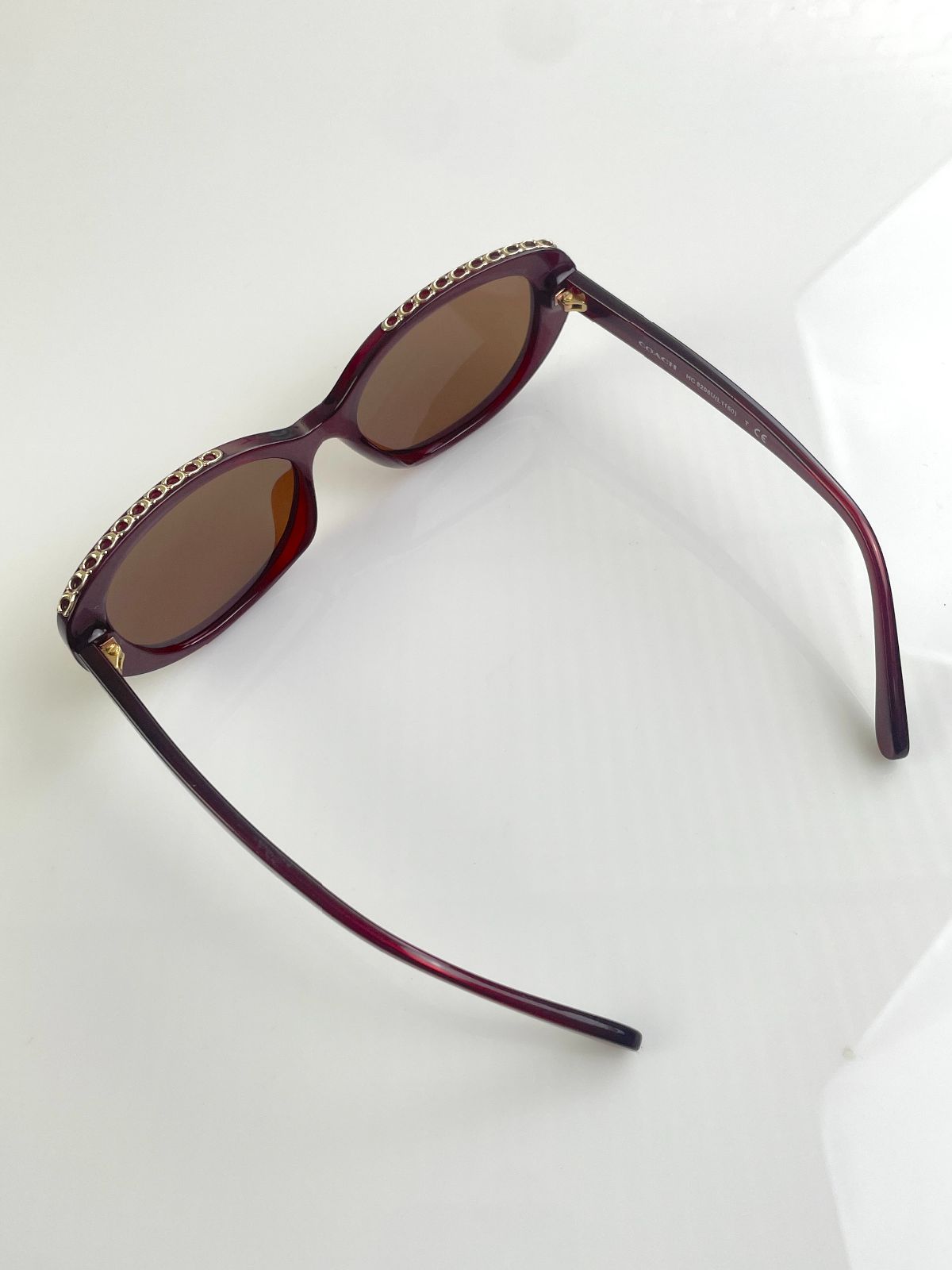 COACH CUSTOM TINT, ROUNDED CAT EYE SUNGLASSES, MONOGRAM C-CHAIN EMBELLISHED TOP BROW - AUBERGINE in MAROON,