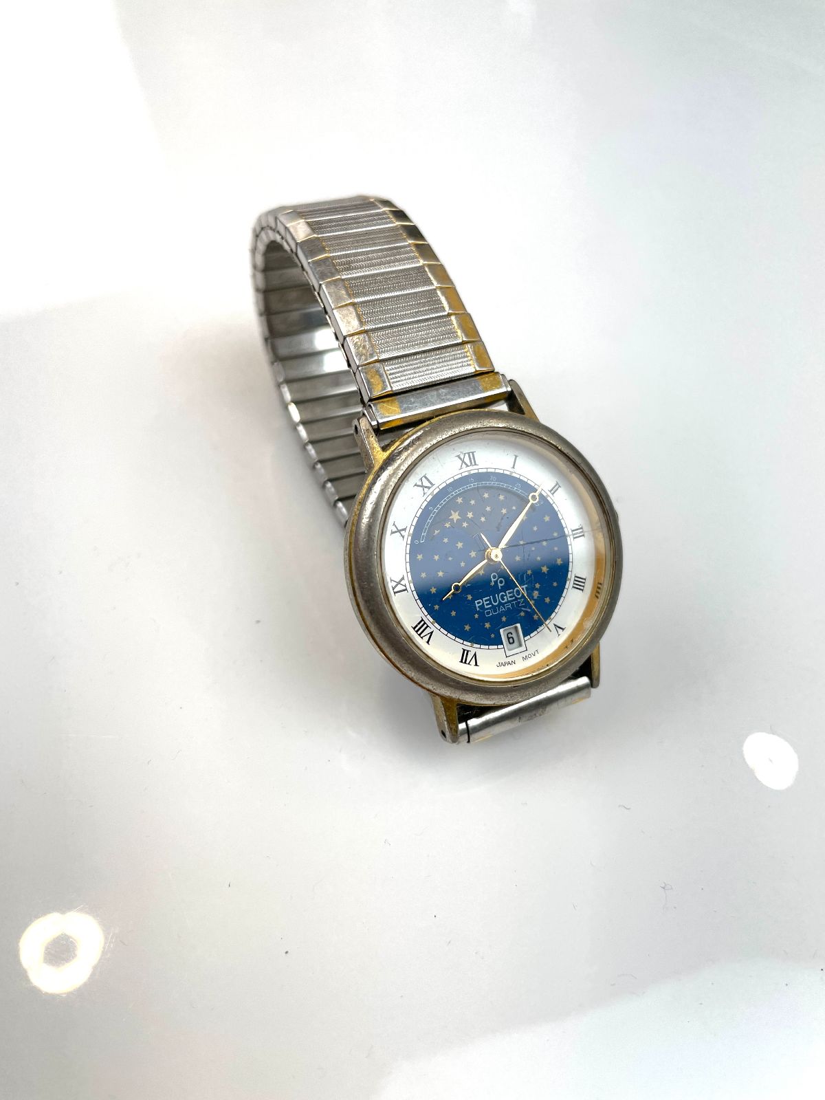 PEUGEOT QUARTZ STAR DIAL TWO-TONE STRETCH BAND WRIST WATCH STAINLESS STEEL in BLUE, SILVER