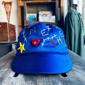 NETHERFRIENDS X KHARY HAND EMBROIDERED WITH ANTIQUE AND HANDMADE BUTTONS HAT in BLUE